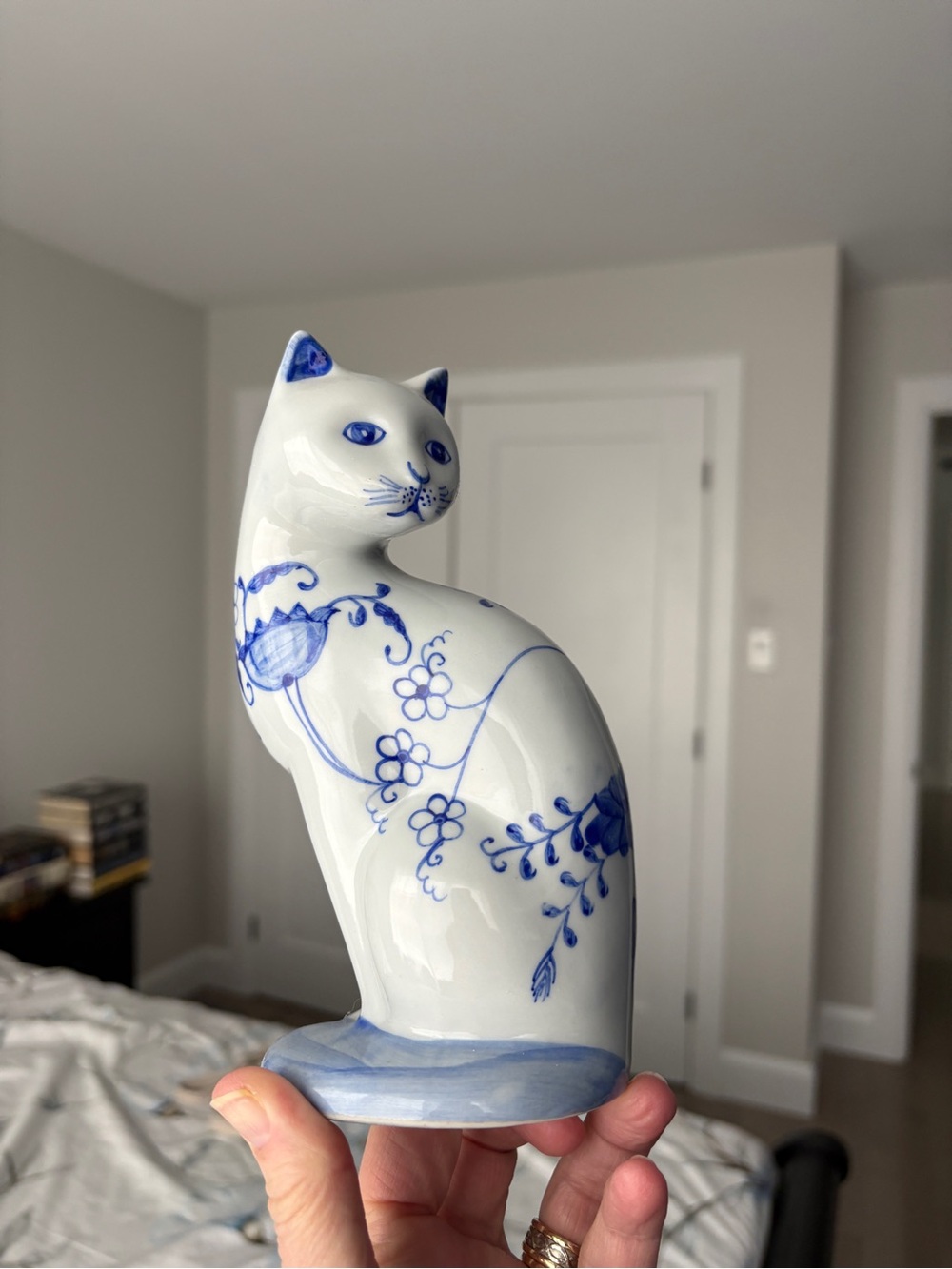 White Ceramic Cat Figurine with Blue Floral Detail